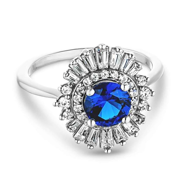 Shown with 1ct Round Cut Lab Grown Blue Sapphire|Unique stunning vintage style diamond halo engagement ring with baguette cut diamonds surrounding a 1ct round cut lab grown blue sapphire in 14k white gold