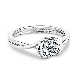 Unique contemporary solitaire engagement ring with twisted band design holding a 1ct round cut lab grown diamond in platinum setting