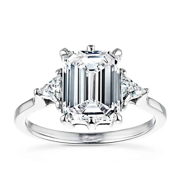 Shown with a 2ct Emerald Cut & Two Triangle Cut Lab Grown Diamonds|Gorgeous conflict free three stone engagement ring with 2ct emerald cut lab grown diamond center stone with triangle side stones set in 14k white gold band