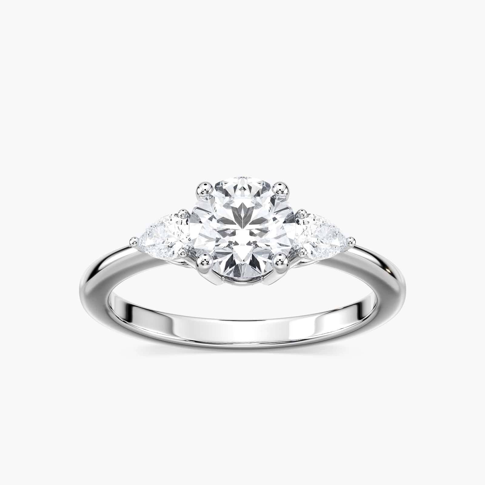 Shown with 2ct Lab Grown Champagne Pink Sapphire in 14k White Gold|Beautiful lab grown champagne pink sapphire engagement ring with pear cut side stones in 14k white gold