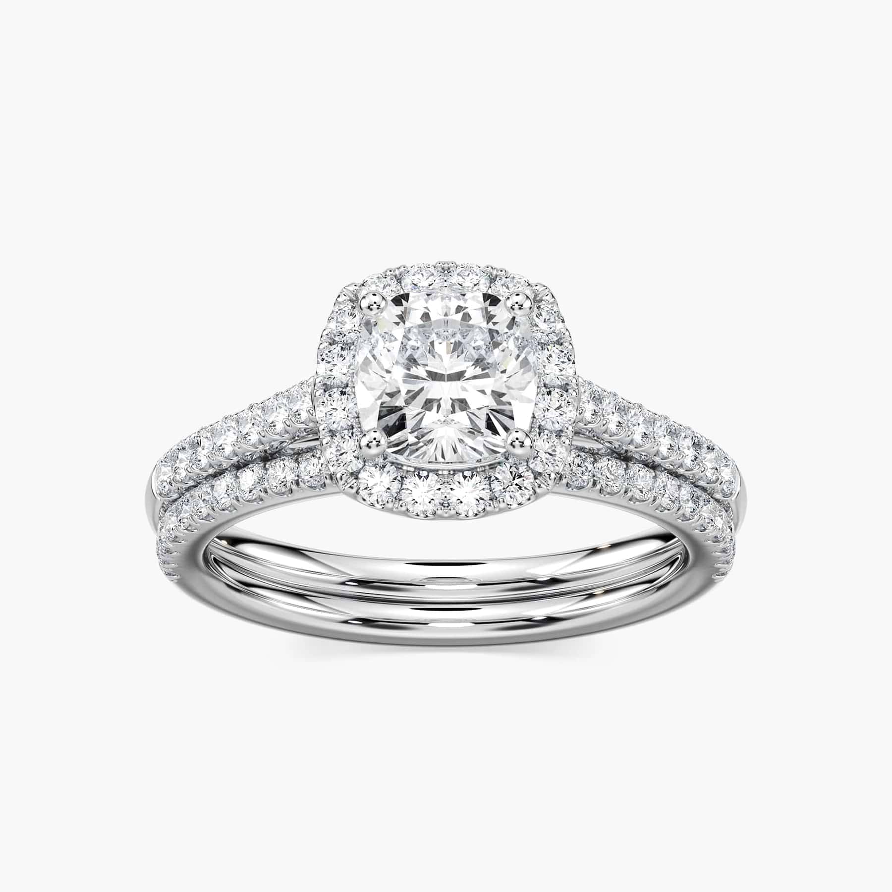 Shown with a 1.0ct Cushion cut Lab-Grown Diamond with a diamond accented halo and diamonds accenting the band in recycled 14K white gold with matching band, purchase the set for a discount | diamond halo accented engagement ring Shown with a 1.0ct Cushion cut Lab-Grown Diamond with a diamond accented halo and diamonds accenting the band in recycled 14K white gold with matching band
