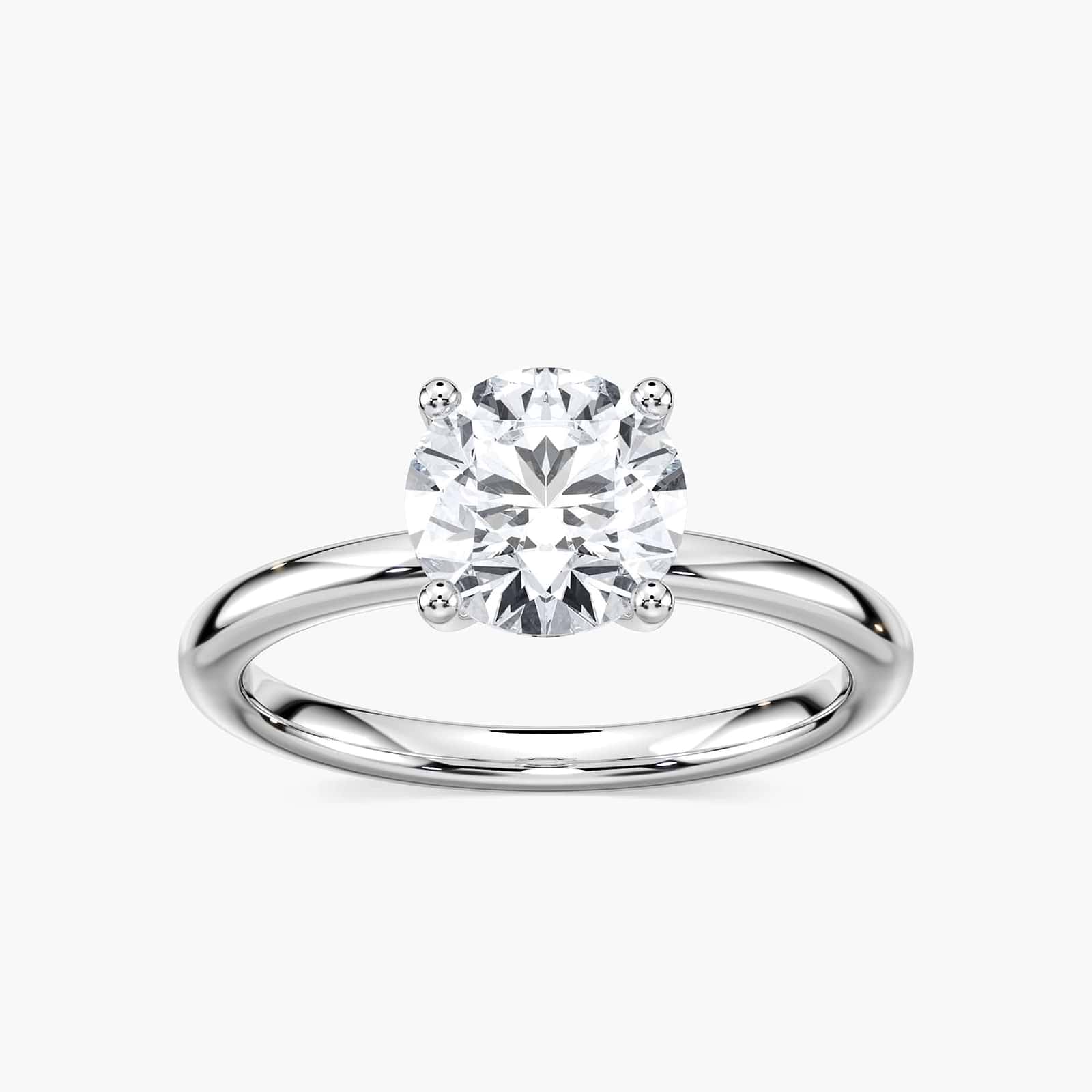 Shown here with a 1.0ct Round Cut Lab Grown Diamond center stone in 14K Rose Gold|shown with 1 carat lab grown diamond center stone with nature inspired floral prong head set in 14k rose gold