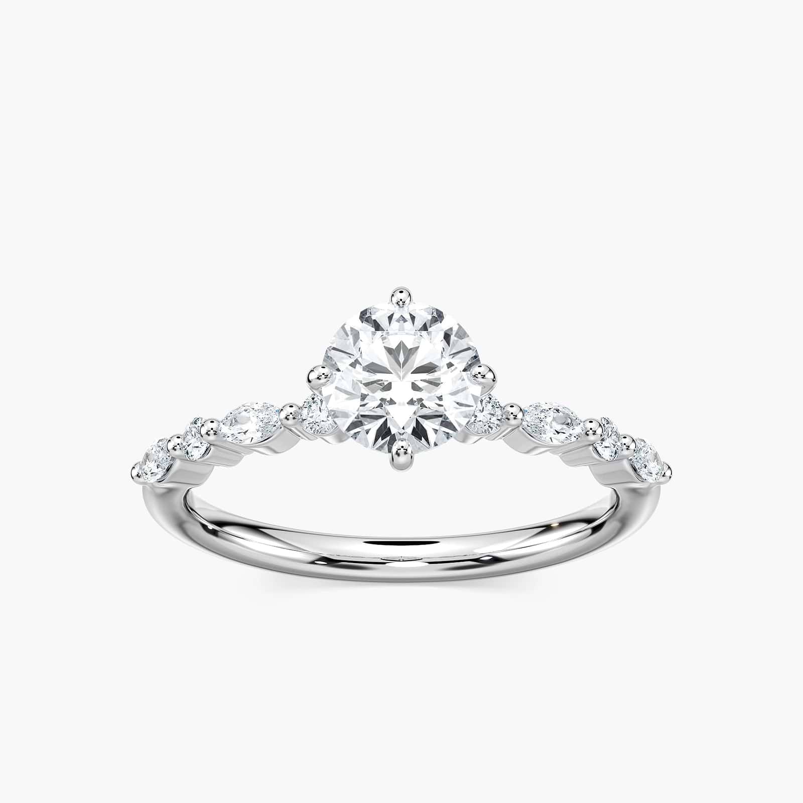Shown here with a 1.0ct Round Cut center stone in 14K Yellow Gold|summer engagement ring with diamond accenting stones and a round cut center stone set in 14k yellow gold metal