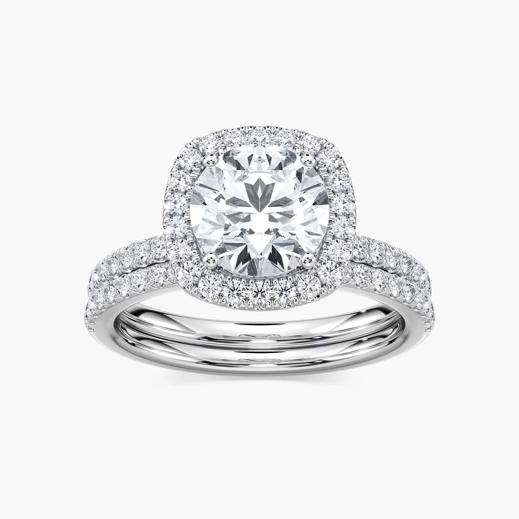 Shown with a 1.0ct Round cut Lab-Grown Diamond with diamond accented halo and band in recycled 14K white gold with matching wedding band, can be purchased together for a discounted price | wedding set halo diamond accented Shown with a 1.0ct Round cut Lab-Grown Diamond with diamond accented halo and band in recycled 14K white gold with matching wedding band, can be purchased together for a discounted price
