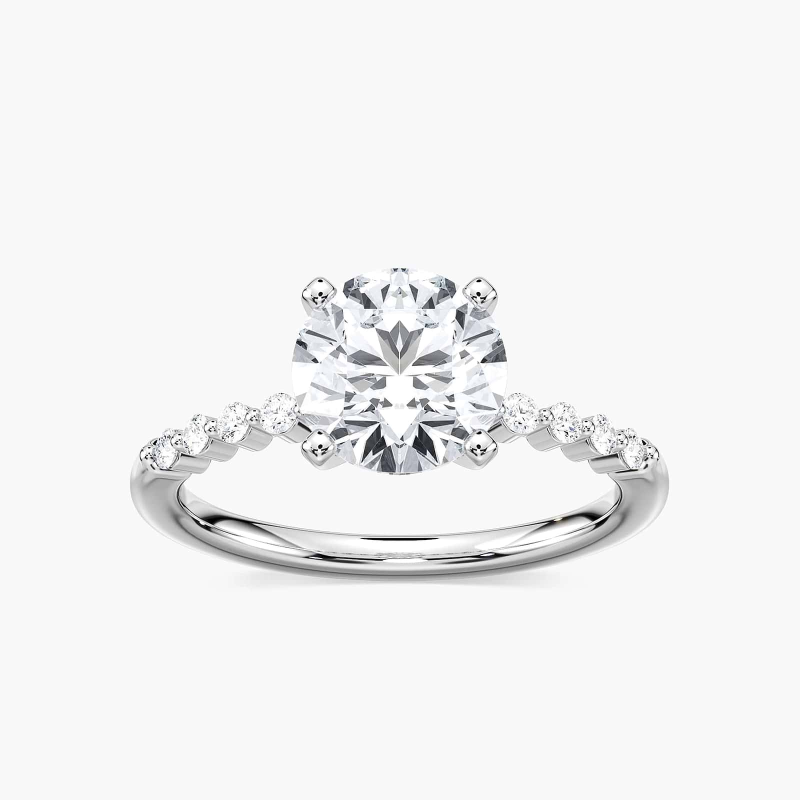 Shown with a 1.0ct Round cut Lab-Grown Diamond with accenting diamonds on the band in recycled 14K white gold | diamond accented engagement ring Shown with a 1.0ct Round cut Lab-Grown Diamond with accenting diamonds on the band in recycled 14K white gold