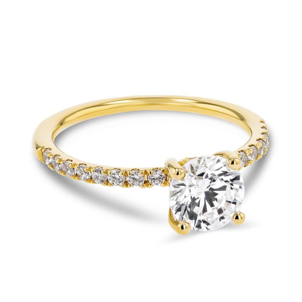 Shown here with a 1.0ct Round Cut Lab Grown Diamond center stone in 14K Yellow Gold|diamond accented engagement ring with a pinched hidden halo set with a 1 carat round cut lab grown diamond in 14k yellow gold metal