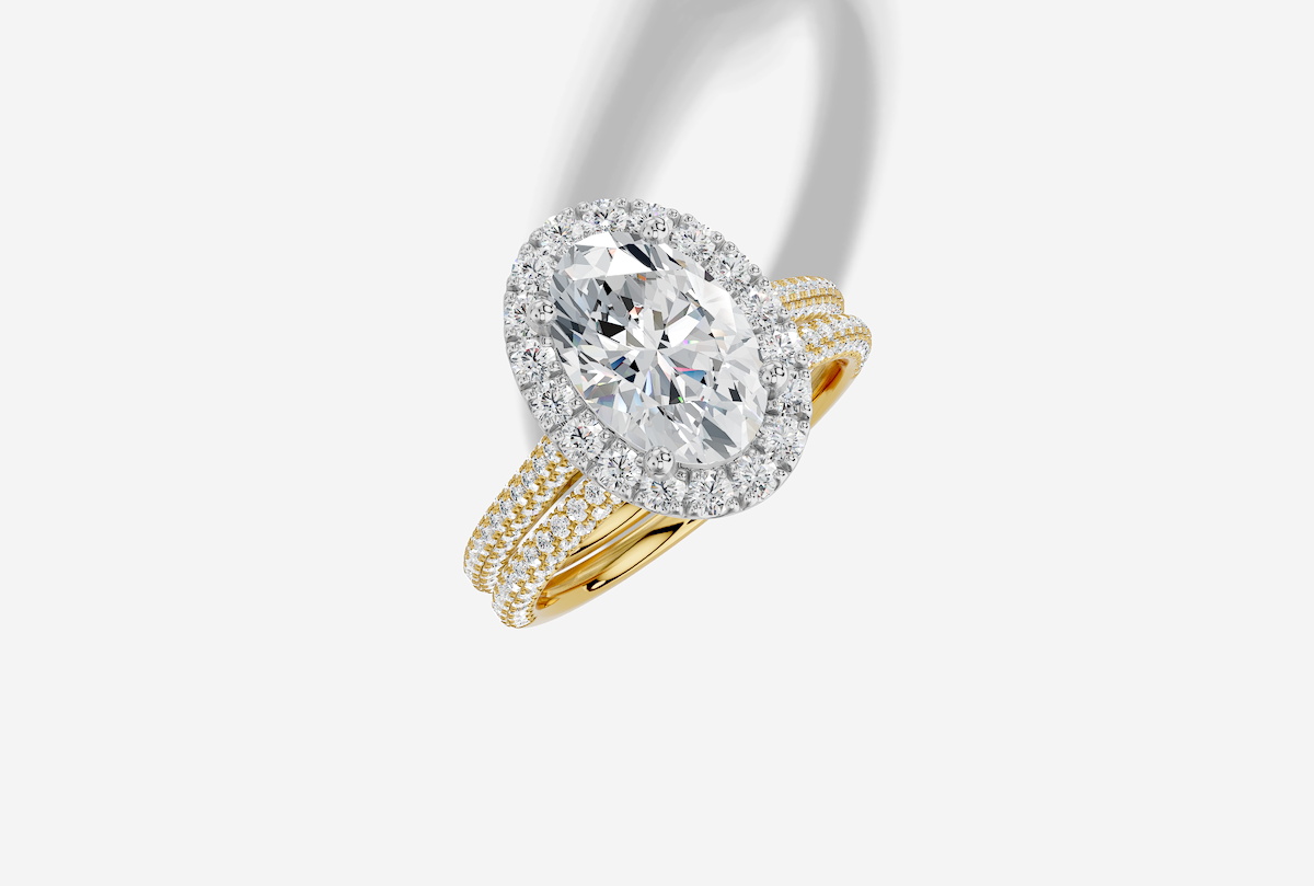2.67 ctw Oval Cut Lab Grown Diamond 3 Sided Micro Cathedral Halo Engagement Ring in 18K Gold and 0.40 ctw Matching Band