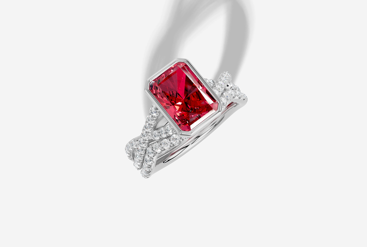 9.0 x 7.0 mm Radiant Cut Lab Grown Ruby Micro Prong Twist Bezel Engagement Ring in 18K Gold and 0.27 ctw Matching Band