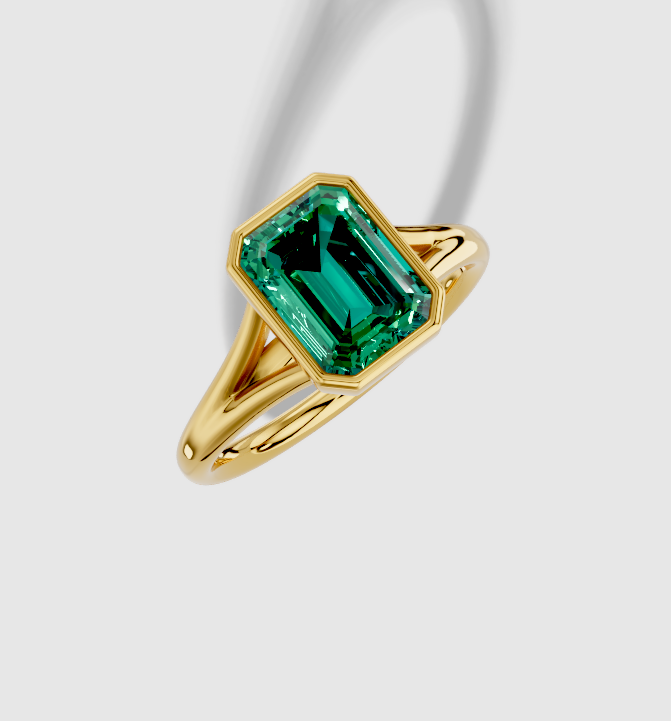 9.5x7.0 mm Emerald Cut Lab Grown Emerald Standard Split Shank Bezel Engagement Ring in 18K Gold