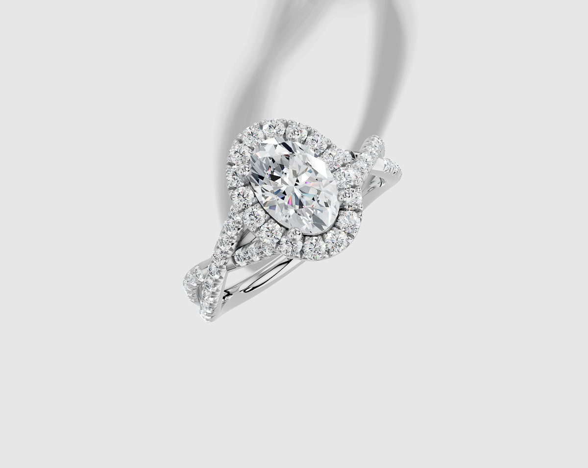 1.54 ctw Oval Cut Lab Grown Diamond French Pave Twist Halo Engagement Ring in 14K Gold