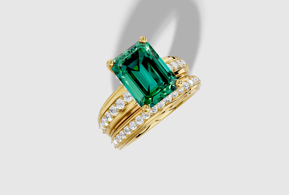 12.0 x 9.0 mm Emerald Cut Lab Grown Emerald Shared Prong Wide Hidden Halo Engagement Ring in 14K Gold and 0.31 ctw Matching Band
