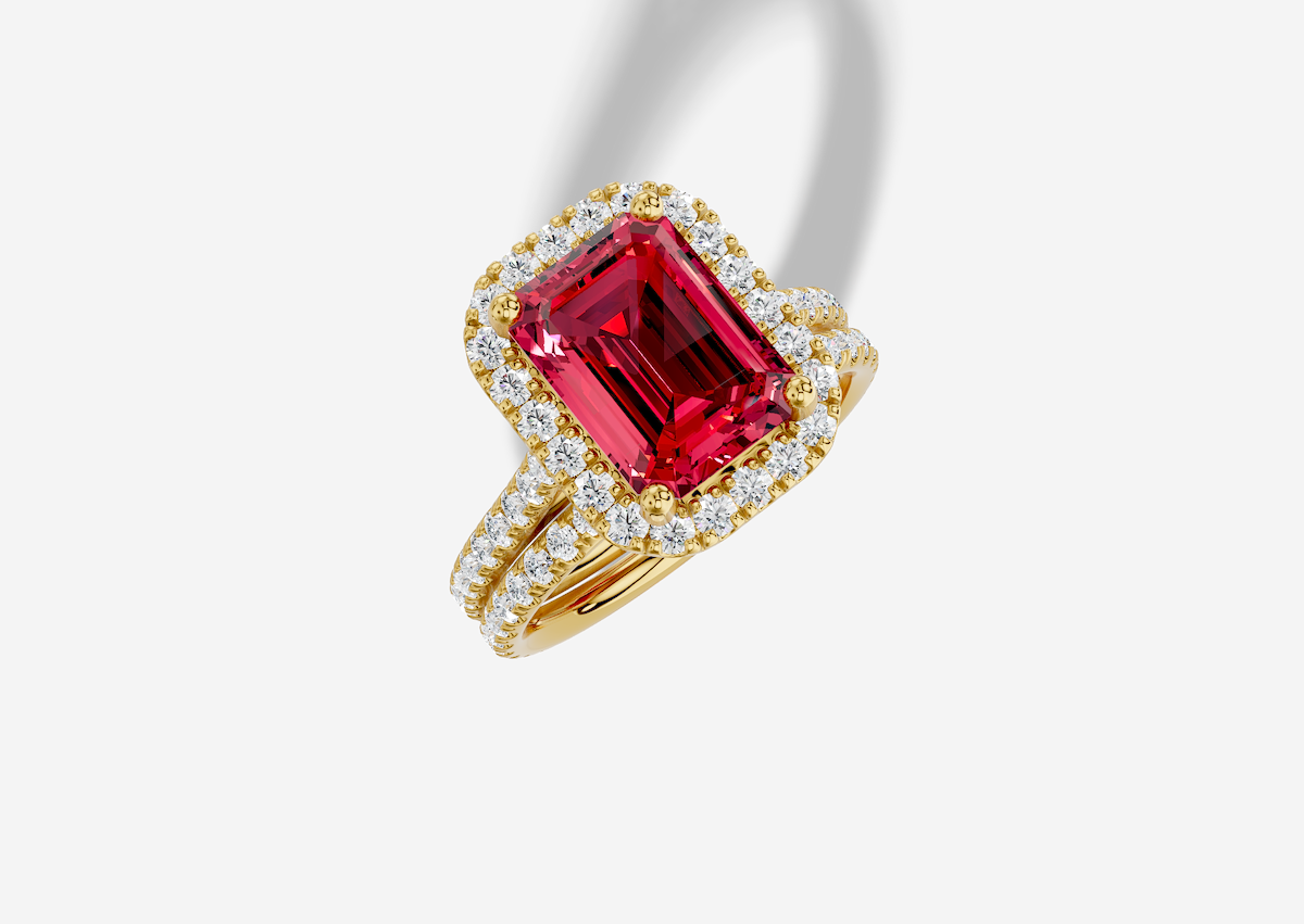 10.5 x 8.0 mm Emerald Cut Lab Grown Ruby Micro Prong Cathedral Halo Engagement Ring in 18K Gold and 0.36 ctw Matching Band