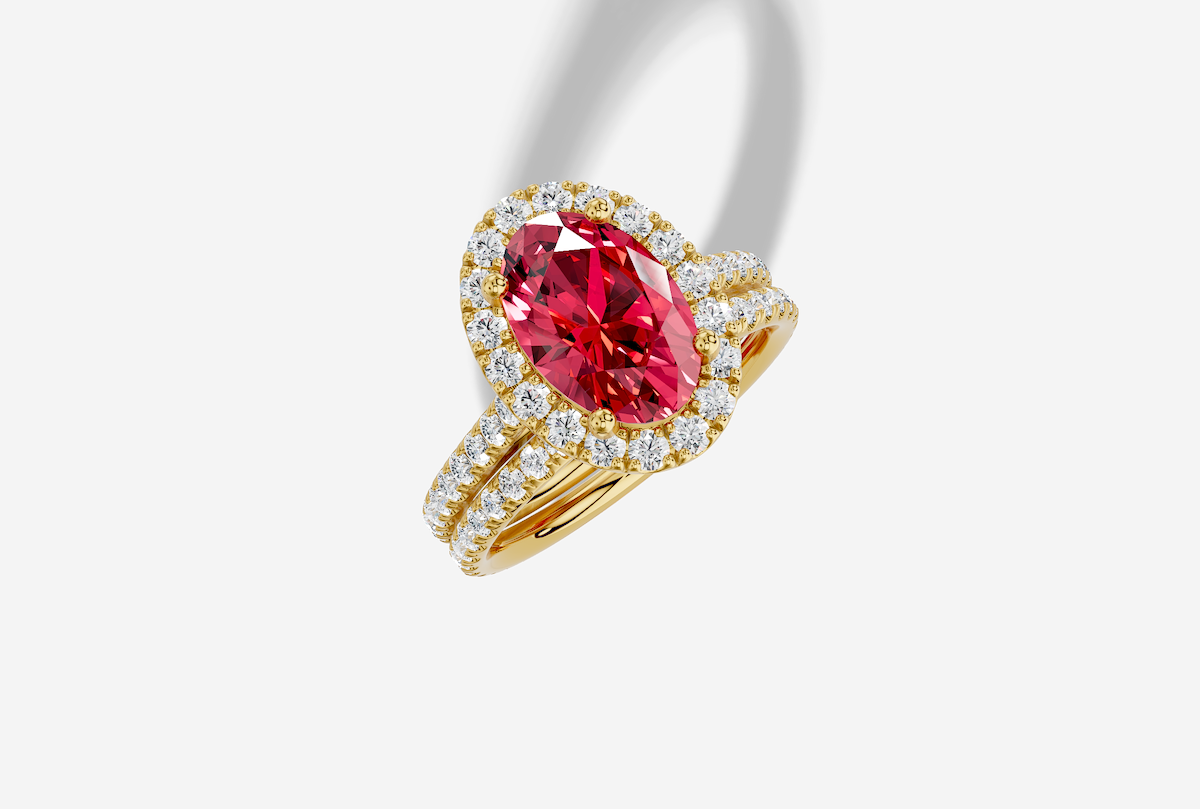 10.0 x 7.0 mm Oval Cut Lab Grown Ruby Micro Prong Cathedral Halo Engagement Ring in 18K Gold and 0.37 ctw Matching Band