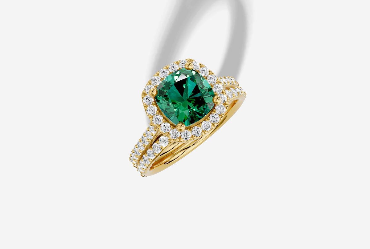 8.5 x 7.7 mm Cushion Cut Lab Grown Emerald Shared Prong Cathedral Halo Engagement Ring in 14K Gold and 0.37 ctw Matching Band