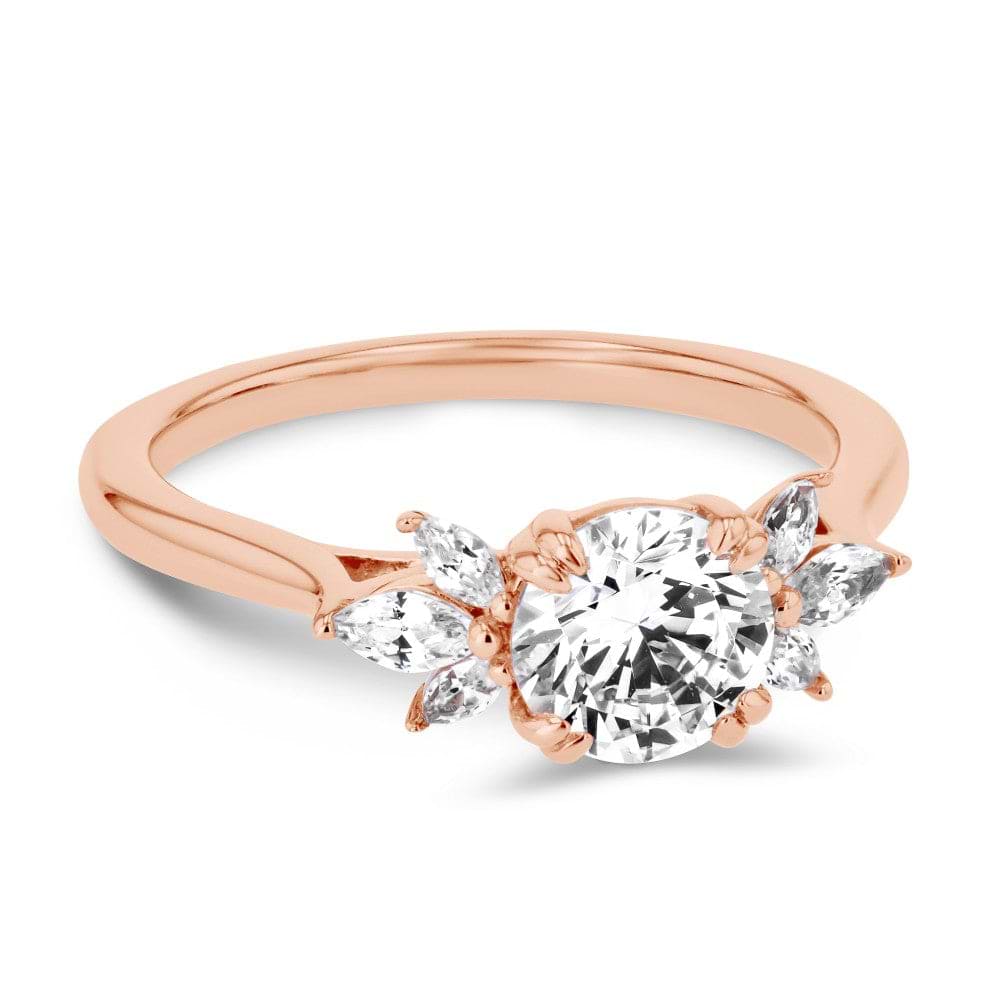 Shown here with a 1.0ct Round Cut Lab Grown Diamond center stone in 14K Rose Gold|floral inspired diamond accented engagement ring with round cut lab grown diamond center stone set in 14k rose gold metal