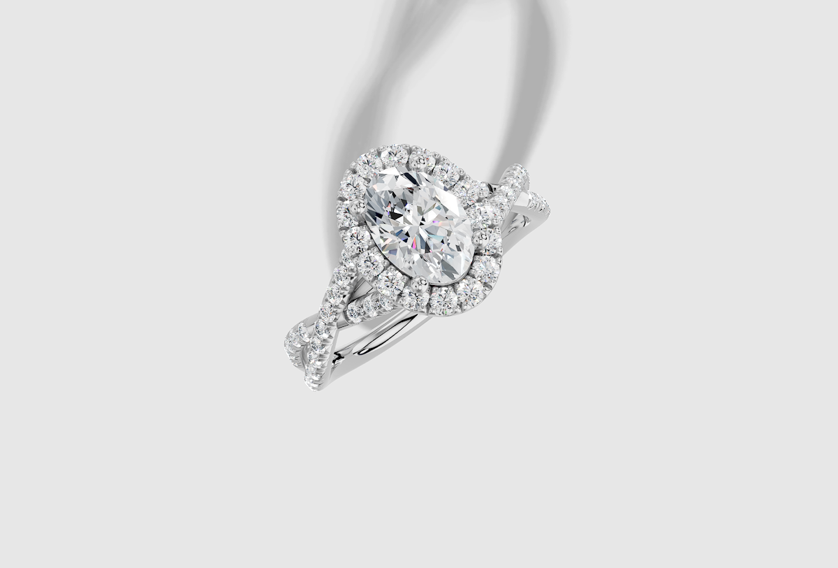 1.54 ctw Oval Cut Lab Grown Diamond French Pave Twist Halo Engagement Ring in 14K Gold