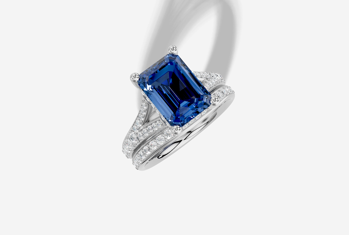 10.5 x 8.0 mm Emerald Cut Lab Grown Sapphire Pave Split Shank Hidden Halo Engagement Ring in 14K Gold and 0.30 ctw Matching Band