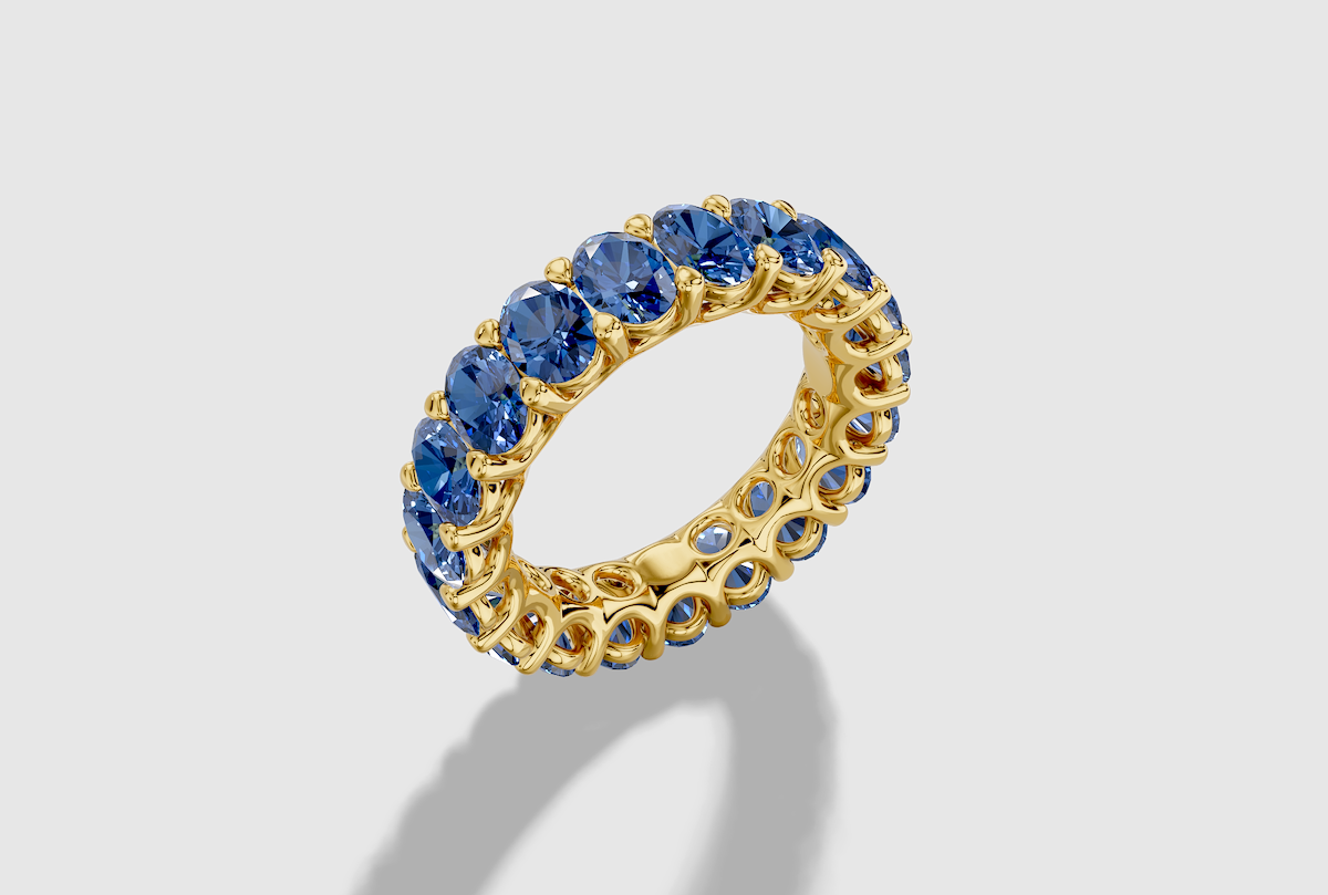 Oval Cut Lab Grown Sapphire Shared Prong Eternity Band in 14K Gold