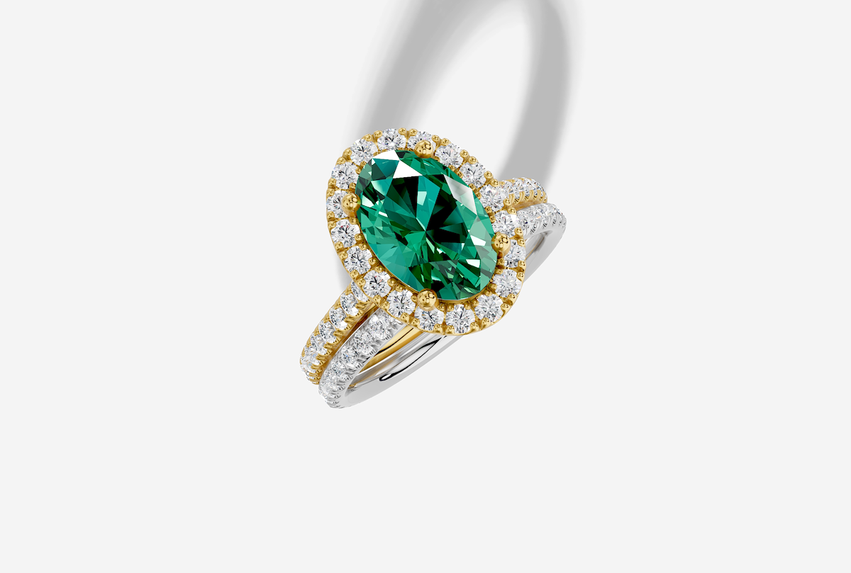 10.0 x 7.0 mm Oval Cut Lab Grown Emerald Micro Prong Cathedral Halo Engagement Ring in 18K Gold and 0.37 ctw Matching Band