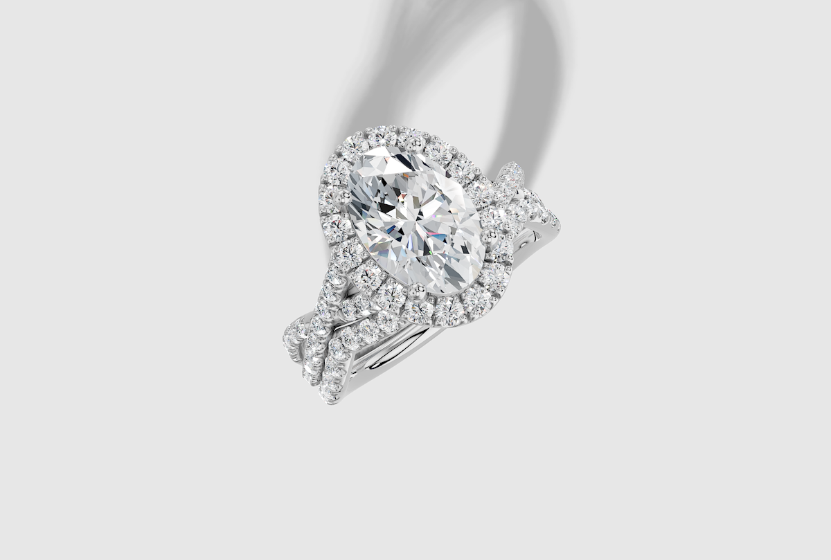 2.64 ctw Oval Cut Lab Grown Diamond Micro Prong Twist Halo Engagement Ring in Platinum and 0.28 ctw Matching Band