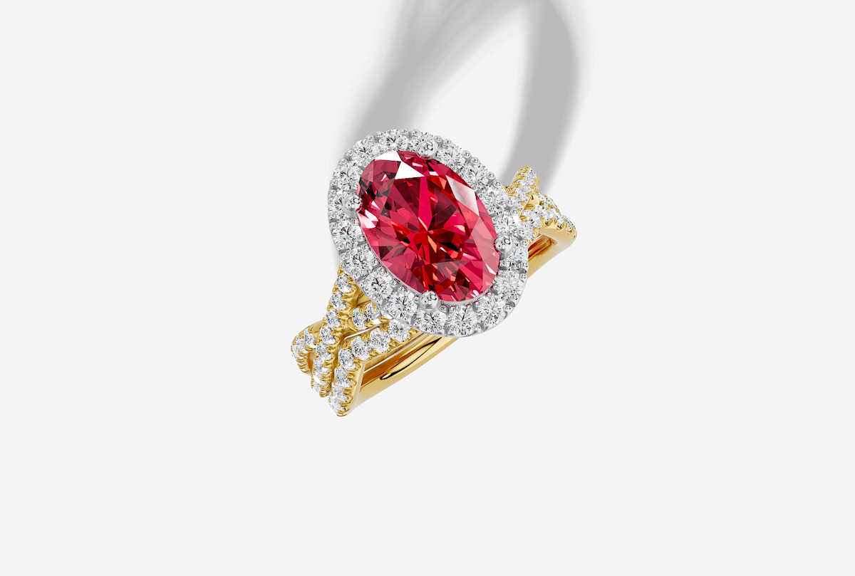 10.0 x 7.0 mm Oval Cut Lab Grown Ruby Micro Prong Twist Halo Engagement Ring in 14K Gold and 0.28 ctw Matching Band