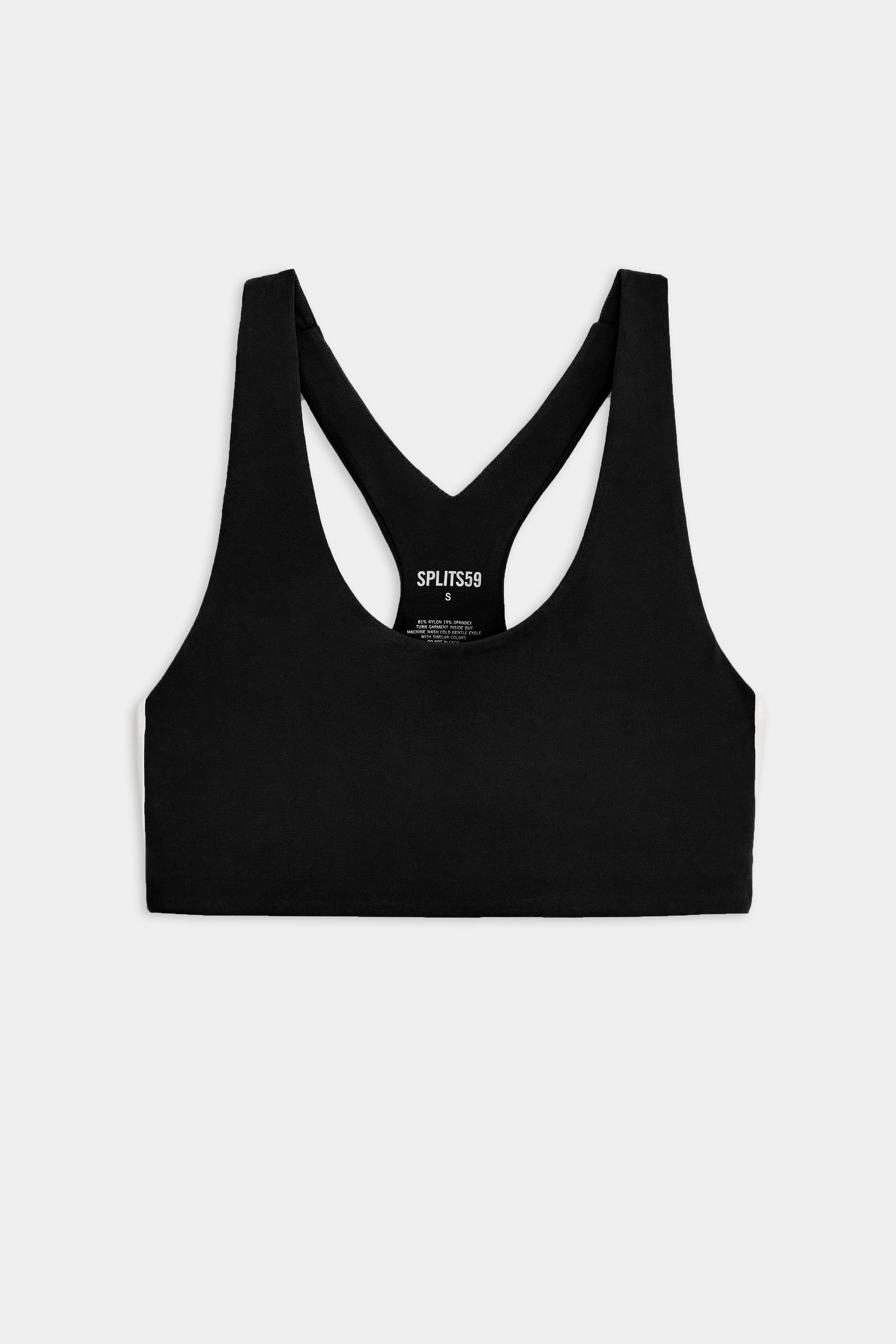 A black racerback sports bra with a scoop neckline is laid flat on a white background.