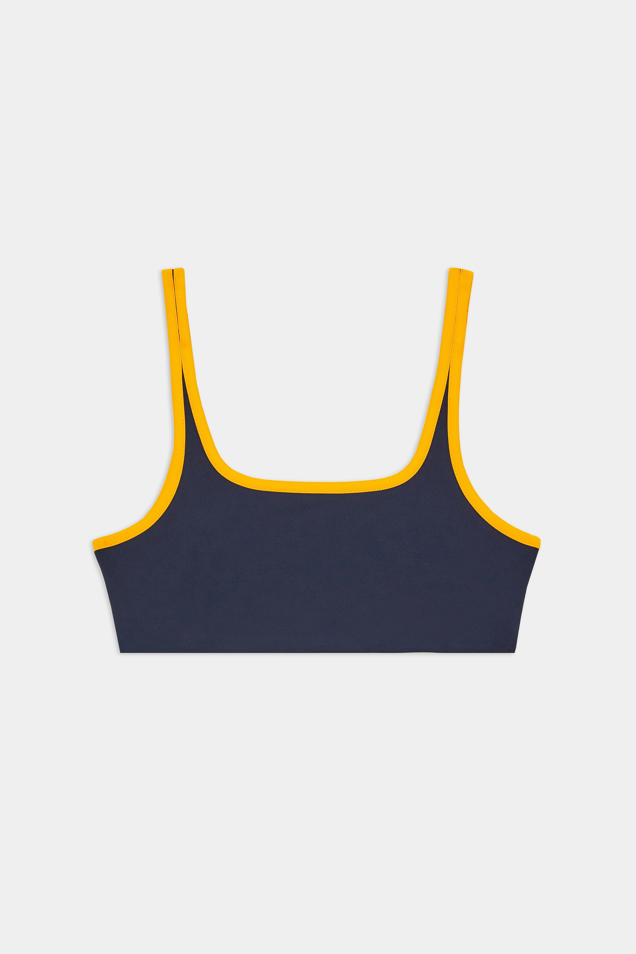 A navy blue crop tank top with yellow trim around the neckline and straps, displayed on a white background.