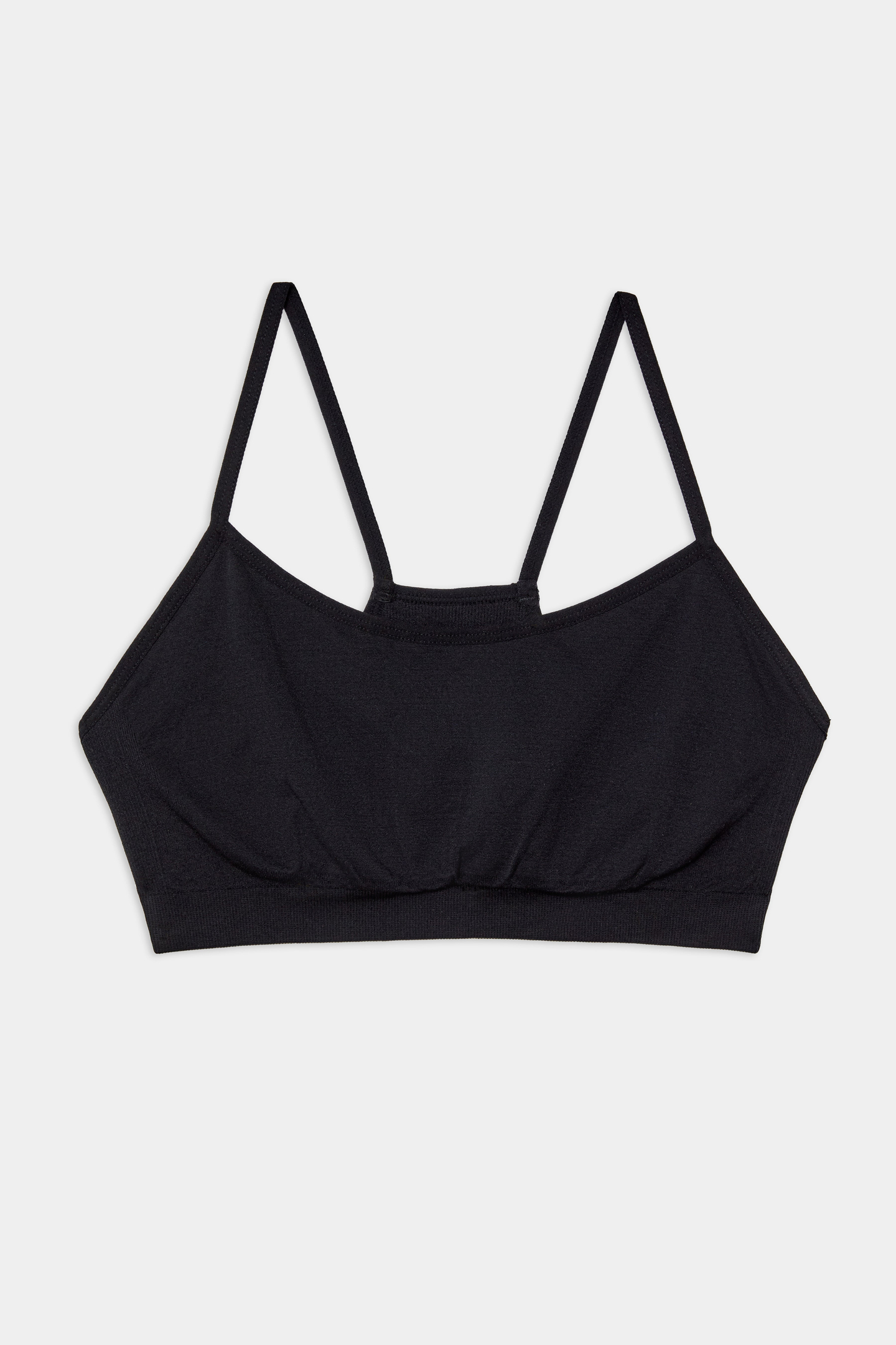 A black bralette with thin adjustable shoulder straps, displayed flat on a white background.