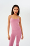 The model is wearing a pink SPLITS59 Airweight Tank - Rosewood and leggings.