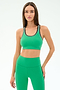 A woman wears the SPLITS59 Robbie Airweight Bra in Spearmint/Military with matching leggings, standing against a plain white background.