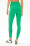 A person wearing SPLITS59 Amber Airweight High Waist 7/8 leggings in Spearmint/Military, paired with white sneakers featuring green stripes, stands on a plain white background, shown from the back.