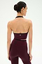 A woman with dark hair in a bun is seen from behind, wearing the SPLITS59 Rory Airweight Halter Bralette in Dark Cherry/Black and matching high-waisted leggings, both crafted from stretchy nylon-spandex fabric, set against a plain white background.