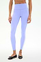A person wears SPLITS59 Miles High Waist Rigor 7/8 leggings in Purple Haze/White with black ballet flats, standing against a plain white background.