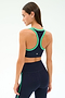 A woman wears the SPLITS59 Robbie Airweight Bra in Indigo/Spearmint, shown from the back against a plain light background.