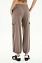 Person wearing SPLITS59 Nico Airweight Cargo Pant in Lentil and black sneakers, shown from the back against a white background—a lightweight, versatile option ideal for workouts.