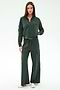 A woman stands facing forward, wearing the SPLITS59 Peaches Airweight Cargo Jacket in Military with matching wide-leg cargo pants, both crafted from soft nylon spandex, paired with white sneakers against a plain light background.