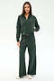 A woman stands facing forward, wearing the SPLITS59 Peaches Airweight Cargo Jacket in Military with matching wide-leg cargo pants, both crafted from soft nylon spandex, paired with white sneakers against a plain light background.