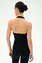 A woman stands with her back to the camera, wearing the SPLITS59 June Rib Halter in black and matching black leggings, both crafted from a soft modal blend with spandex, against a plain light background.