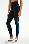 A person wearing the SPLITS59 Ella High Waist Airweight 7/8 leggings in Black/Classic Blue, paired with white sneakers, stands against a plain light background.