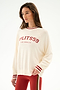 Woman wears the Andie Oversized Fleece Varsity Stripe Sweatshirt - Creme/Splits59 Los Angeles with red leggings featuring tan and white side stripes.