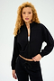 A person with curly hair poses against a plain background, exuding style in the all-season Harlowe Rigor Jacket - Black by SPLITS59, paired with matching pants.