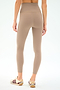 Wearing SPLITS59’s Airweight Super High Waist 7/8 leggings in Latte with taupe and beige sneakers featuring maroon stripes, this look is ideal for hot yoga thanks to the ultra luxe Airweight fabric.