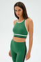 A person wearing the Layla Airweight Bra in Arugula/Indigo by SPLITS59 poses against a plain background.