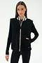 A woman stands against a plain light background, ready for cool weather workouts in the warm SPLITS59 Aster Sherpa Vest - Black, featuring a white zipper and striped collar over a long-sleeve black top and leggings.