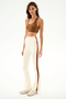 A person wearing a brown sports bra and the SPLITS59 Raquel High Waist Supplex Flare - Creme/Terracotta leggings with side stripes.