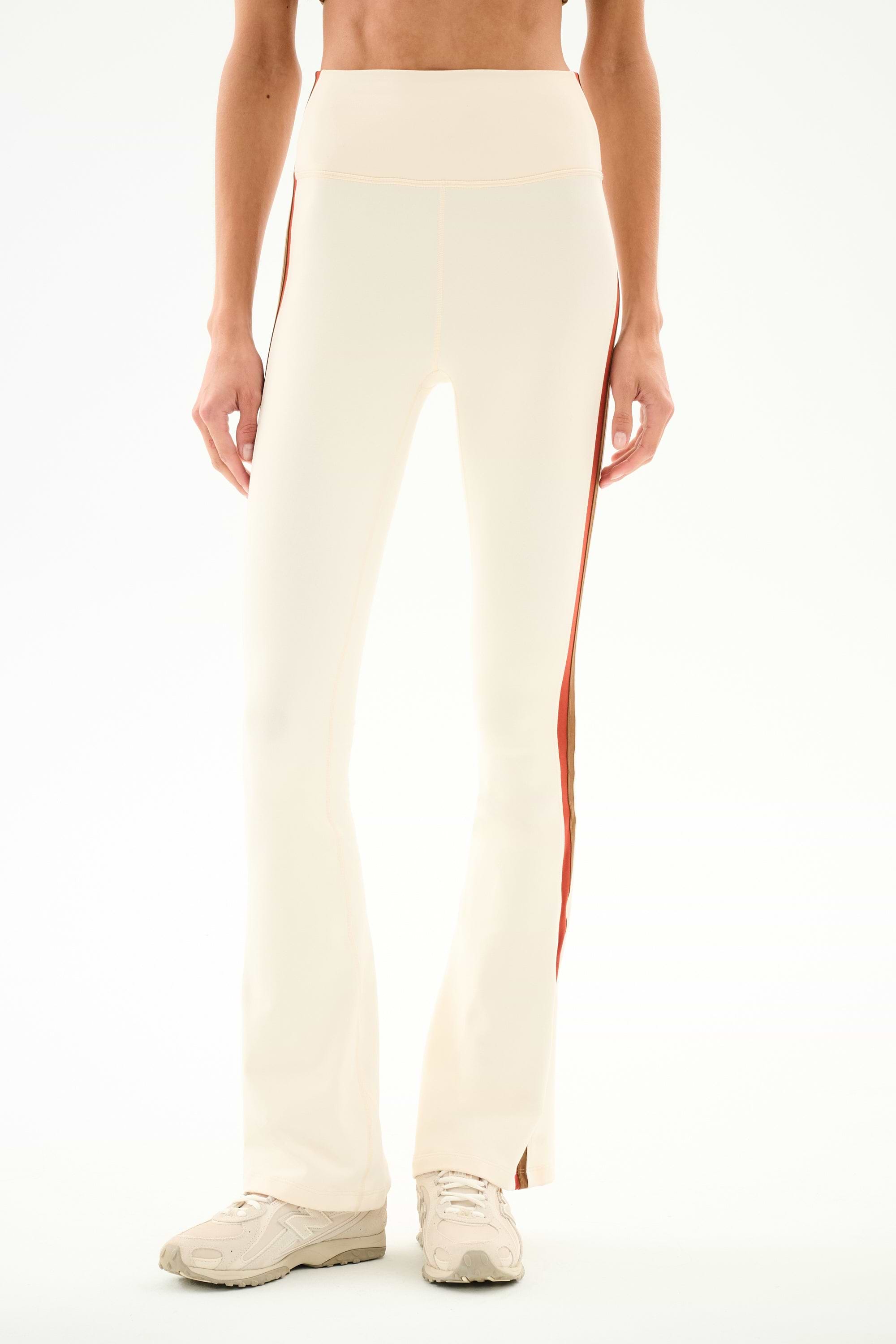 SPLITS59 Raquel High Waist Supplex Flare - Creme/Terracotta cream-colored high-waist flared leggings in stretch fabric with terracotta side stripes and side hem slits.
