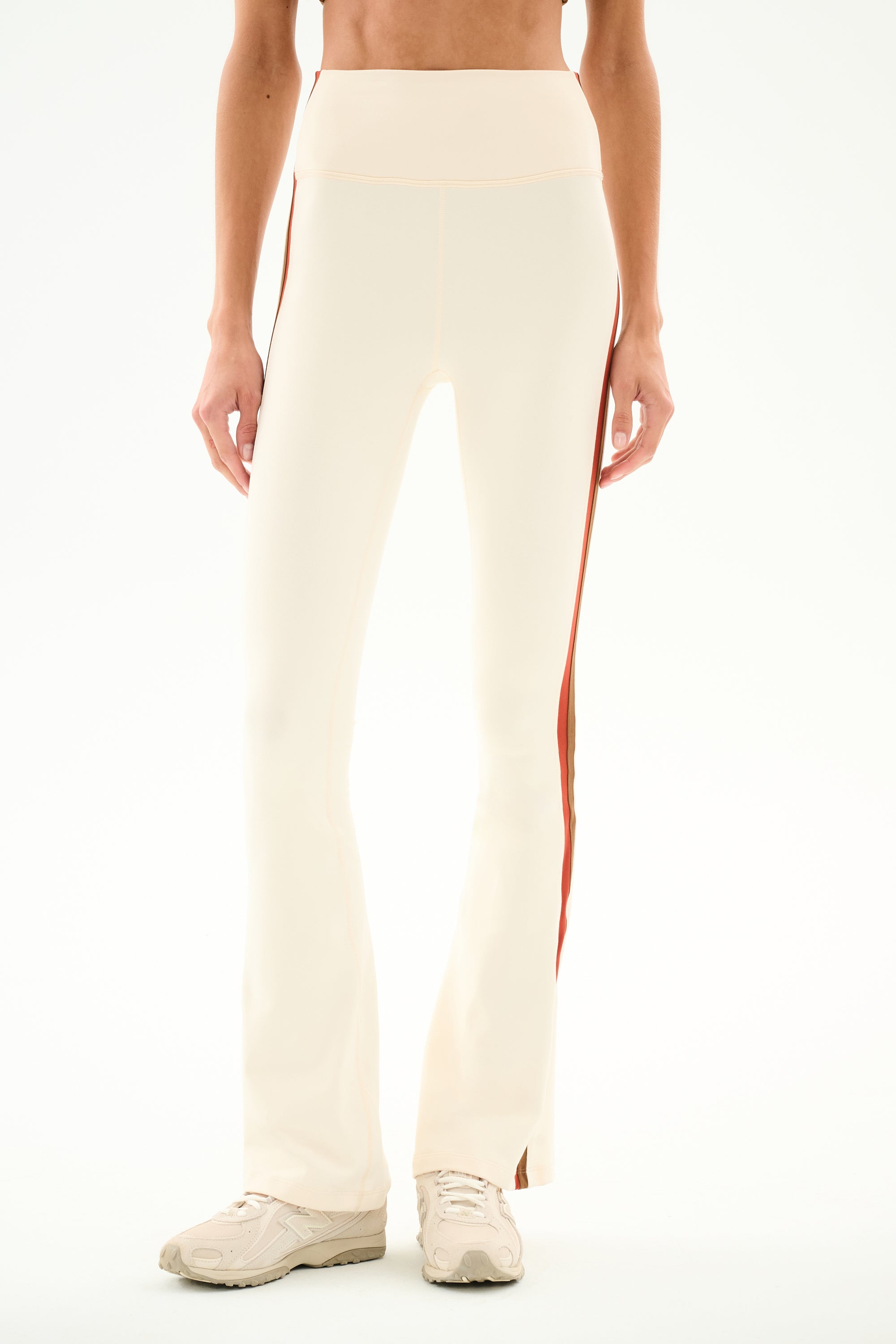 SPLITS59 Raquel High Waist Supplex Flare - Creme/Terracotta cream-colored high-waist flared leggings in stretch fabric with terracotta side stripes and side hem slits.
