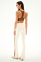 A person seen from behind wears a brown racerback sports bra and Raquel High Waist Supplex Flare - Creme/Terracotta leggings with a terracotta stripe down the leg.