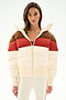Model wears the SPLITS59 Aspen Puffer Jacket - Creme/Terracotta with cream pants, standing against a plain white backdrop.