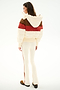 A woman faces away in the Aspen Puffer Jacket - Creme/Terracotta by SPLITS59, paired with cream flared pants and brown shoes, set against a white background.
